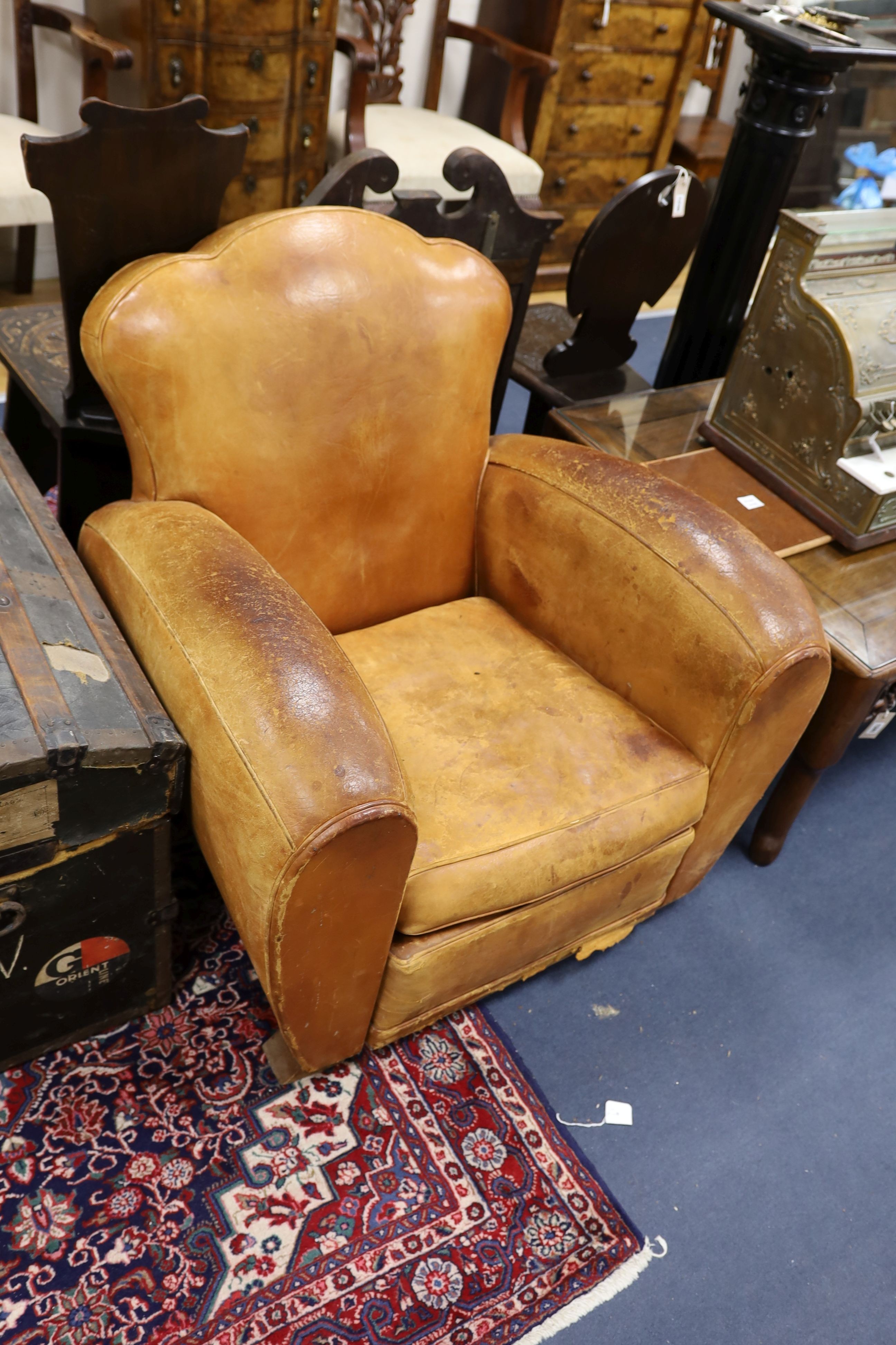 A pair of mid 20th century French tan leather club armchairs, width 90cm, depth 84cm, height 80cm